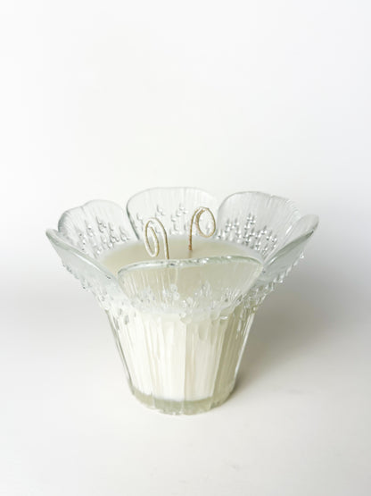 Decorative glass bowl with intricate design on a white background