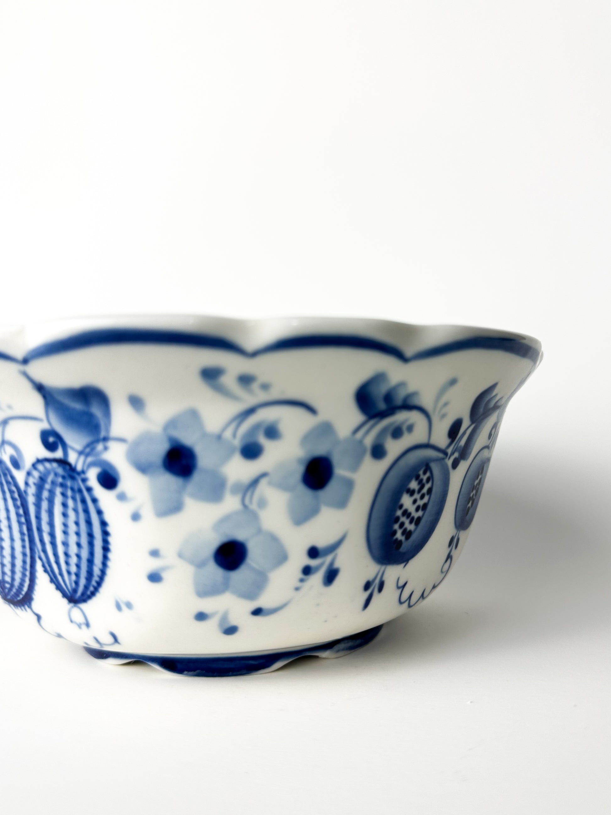 Ceramic bowl with blue floral patterns on a white background