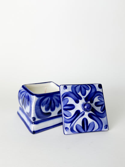 Blue and white ceramic box with intricate patterns on a white background